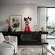 Fiery Red II Iconify Cosmic Boy Figure, 37cm, on a black marble sideboard with framed art and decor in a modern living room.
