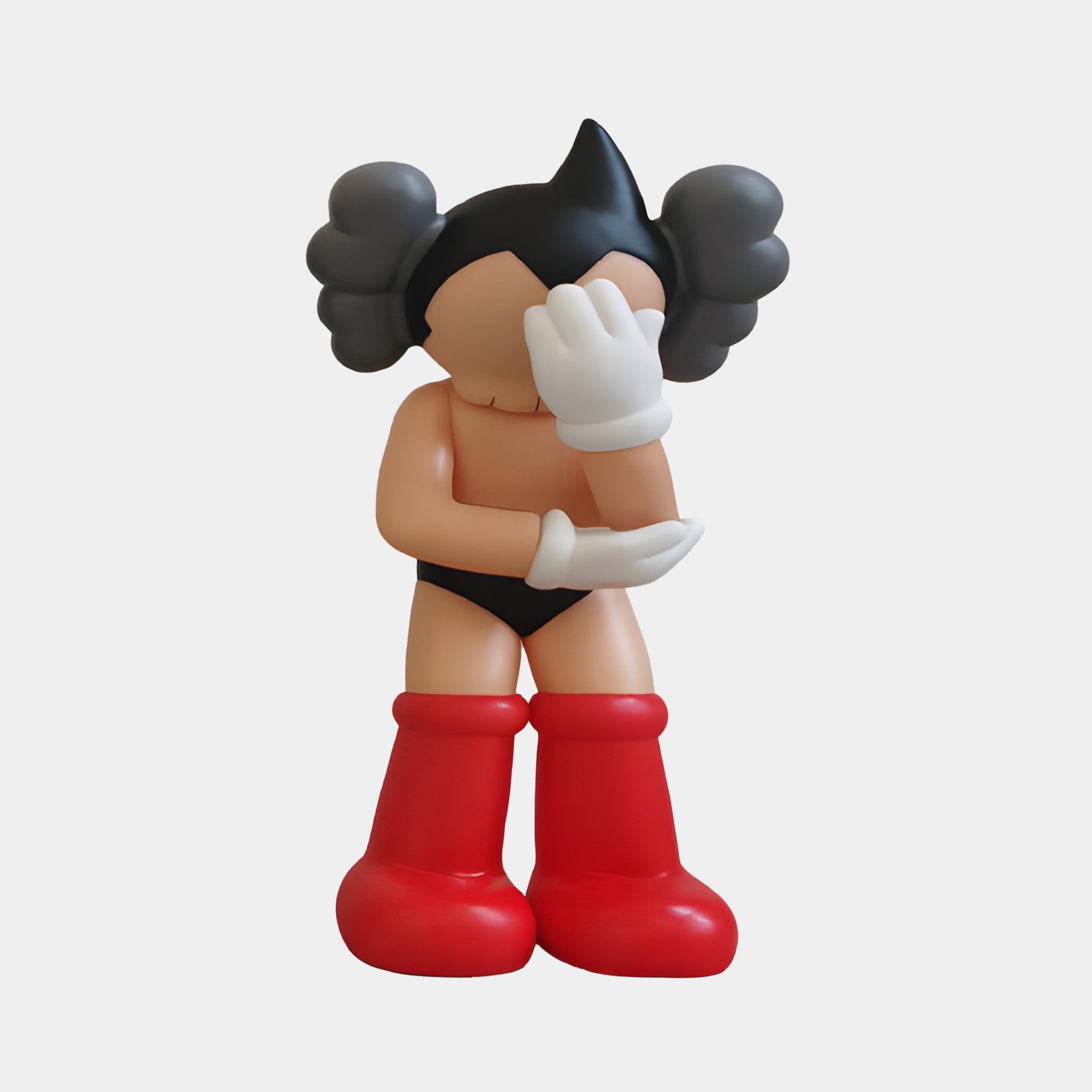 The Giant Sculptures Fiery Red II Iconify Cosmic Boy Figure - 37cm features an anime-inspired character with black hair, gray puffs, red boots, black shorts, and a white-gloved hand covering its face in a standing pose on a plain white background.