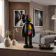 Midnight Black Iconify Anatomy Figure - 37cm on a living room console, black half-body with exposed organs and green skull, near a sofa and framed wall art.