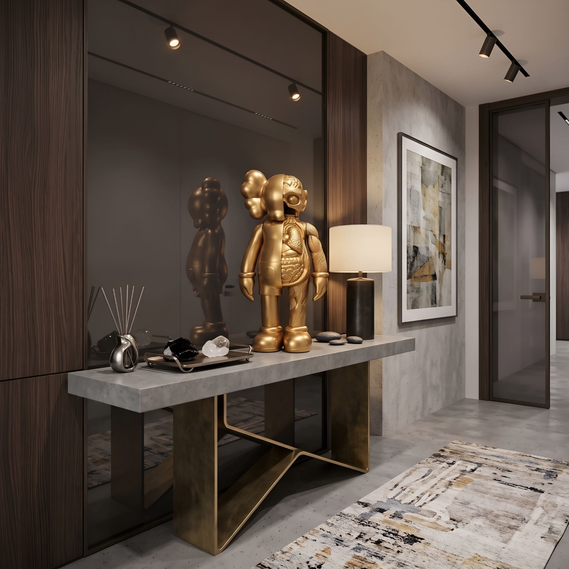 Champagne Satin Gold Iconify Anatomy Figure, 37cm, displayed on a grey console table in an entryway with a mirrored wall panel and framed abstract art.