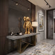 Champagne Satin Gold Iconify Anatomy Figure, 37cm, displayed on a grey console table in an entryway with a mirrored wall panel and framed abstract art.