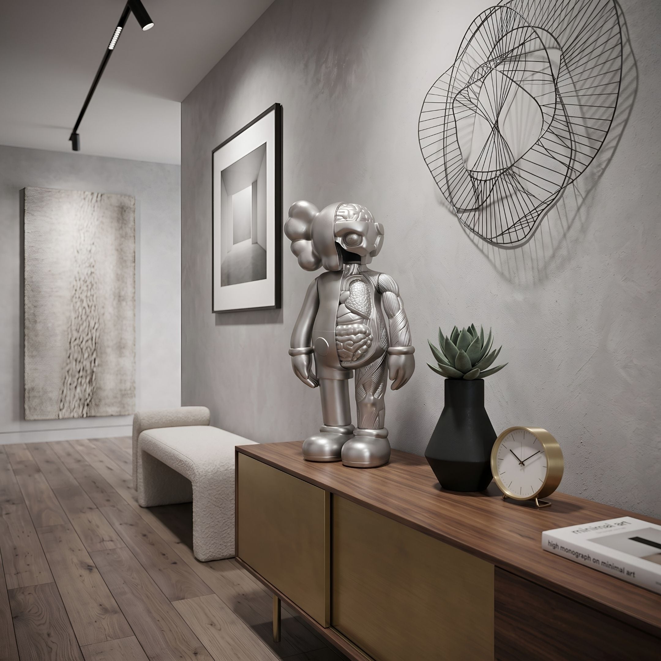 Titanium Slate Iconify Anatomy Figure, 37cm silver anatomical designer sculpture, displayed on a wooden sideboard in a modern hallway with wall art.