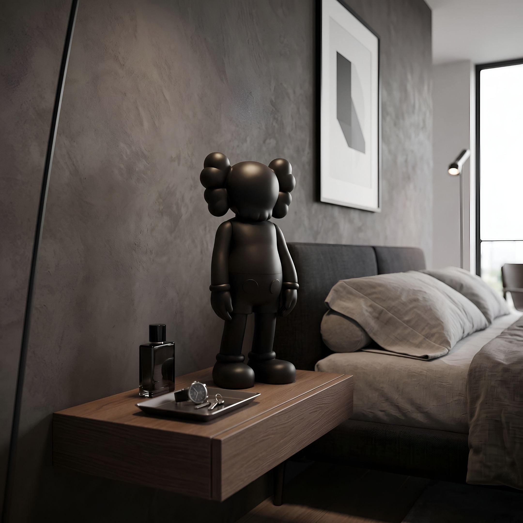 Midnight Black Iconify Standing Figure, 37cm, on a wooden nightstand beside a grey upholstered bed in a modern bedroom.