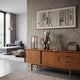 Hazelnut Brown Iconify Standing Figure, 37cm polyvinyl collectible with grey circle-patterned pants, on a wooden sideboard in a modern living room.