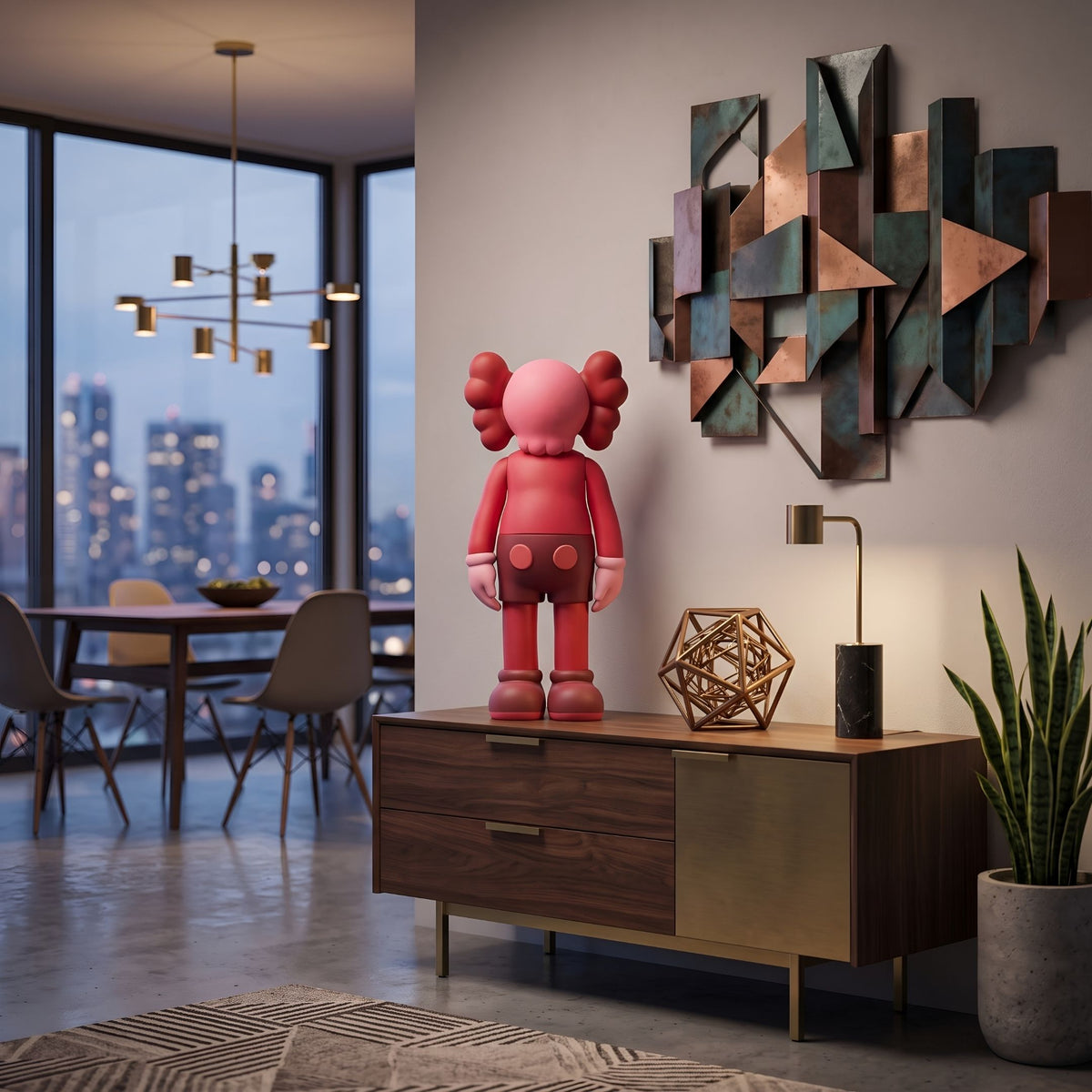 Blush Ruby Iconify Standing Figure (37cm) in red and pink polyvinyl on a wooden sideboard, styled with a geometric metal wall sculpture in a city-view living room.