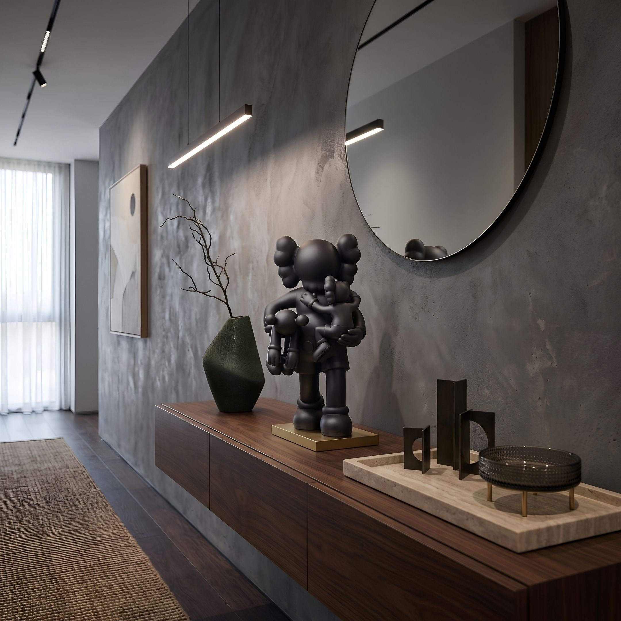 Midnight Black Iconify Family Figure, 38cm matte black sculpture on a gold base atop a walnut sideboard beneath a round mirror in a modern hallway.