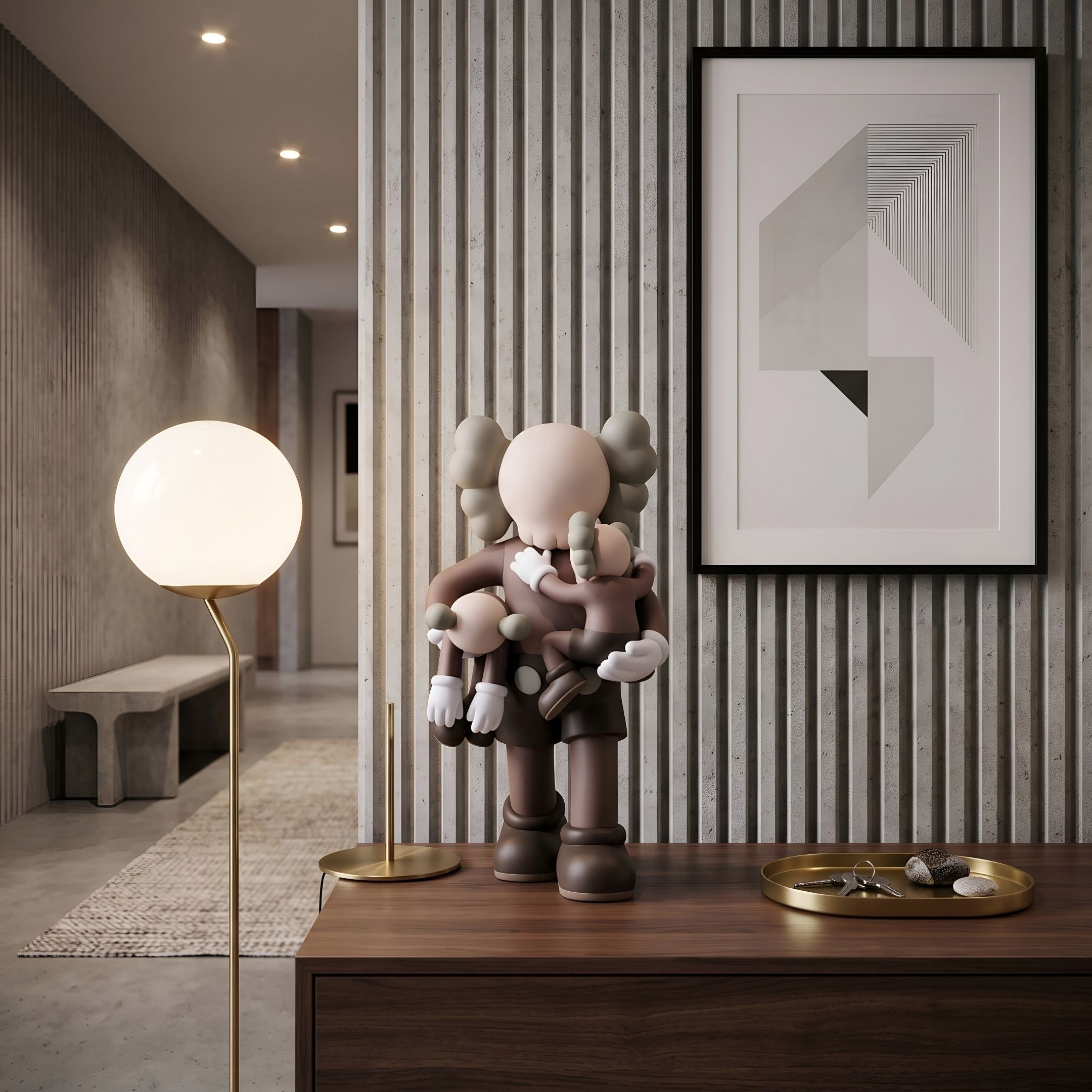 Hazelnut Brown Iconify Family Figure, 38cm, on a wood console table beside a framed abstract print, gold tray, and glowing globe floor lamp in a modern hallway.