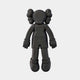 The Obsidian Black Iconify Flat Figure by Giant Sculptures is a 38cm black, stylized character with round ears and puff-like hair. Faceless and designed with simple shapes, it features a cartoonish look that enhances contemporary décor against a white backdrop.