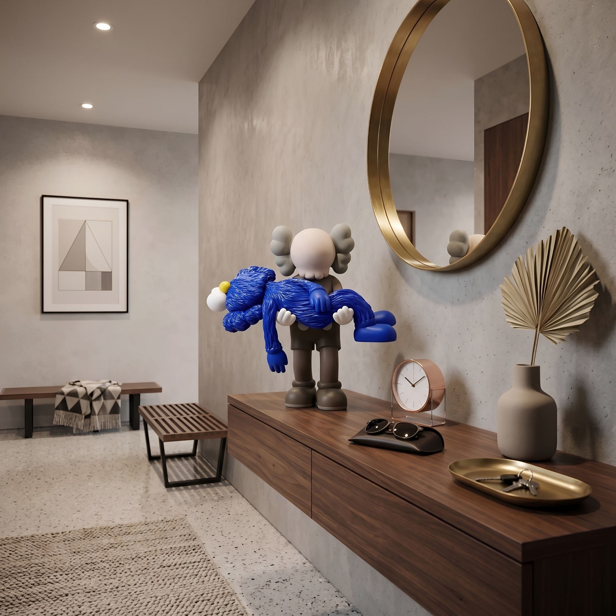 Royal Blue Iconify Rescuing Figure - 38cm, a grey skull-faced figure carrying a blue furry creature, displayed on a wood console table beneath a round gold mirror.