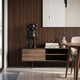 Black Stone Iconify Standing Sculpture - 70cm in matte black resin with white scratch-like marks, displayed on a wooden sideboard against a dark wood-paneled wall.