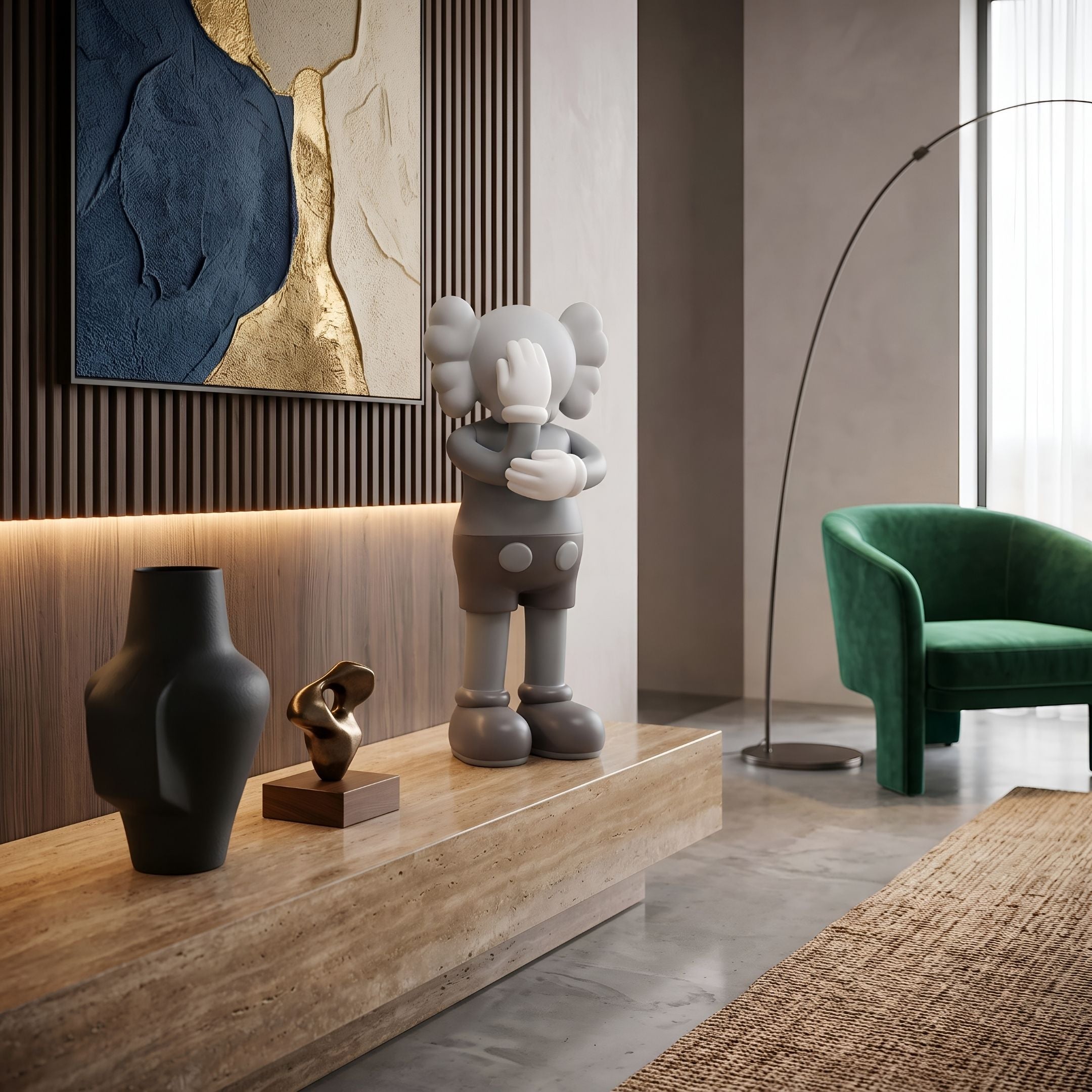 Soft Grey Iconify III Dance Sculpture, 70cm, on a wood platform beside a black vase, in a room with a green armchair and framed wall art.