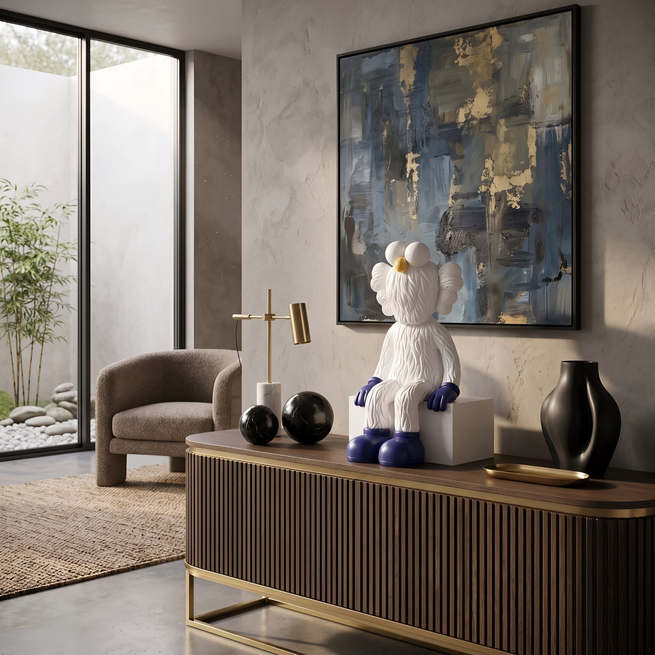 White & Blue Iconify Furry Sitting Sculpture, 70cm, white textured figure with blue gloves and boots, shown on a wood sideboard beneath abstract wall art.
