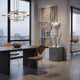 Cloud White Iconify Rollo Sculpture, 80cm resin figure on a grey pedestal in a modern dining room with woven wall art and city-view windows.