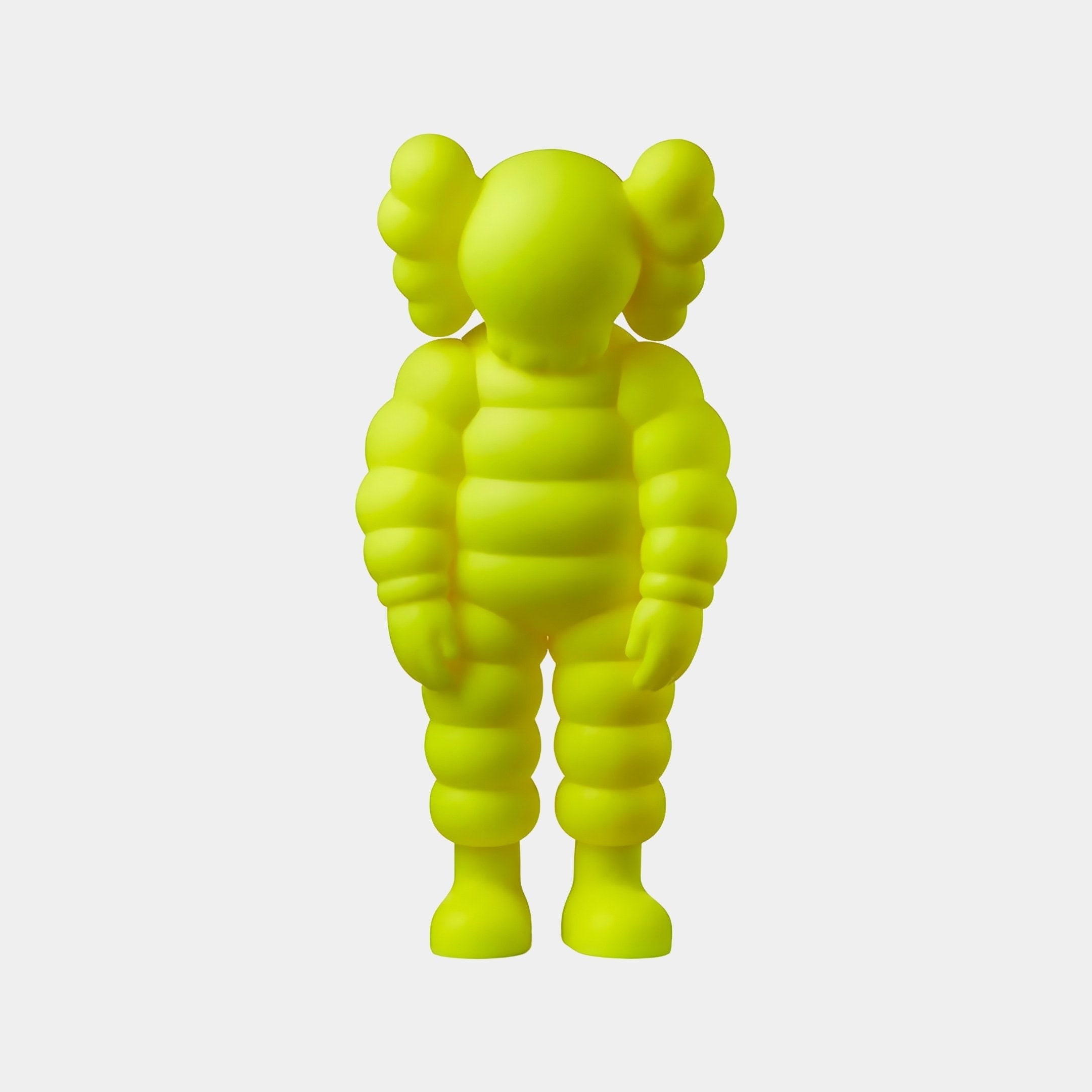 The 80cm Citrus Yellow Iconify Rollo Sculpture by Giant Sculptures stands upright, its smooth, rounded design ideal for modern interiors. Featuring large plush-like limbs and cartoonish ears, it adds charm against a white background—perfect for contemporary spaces.