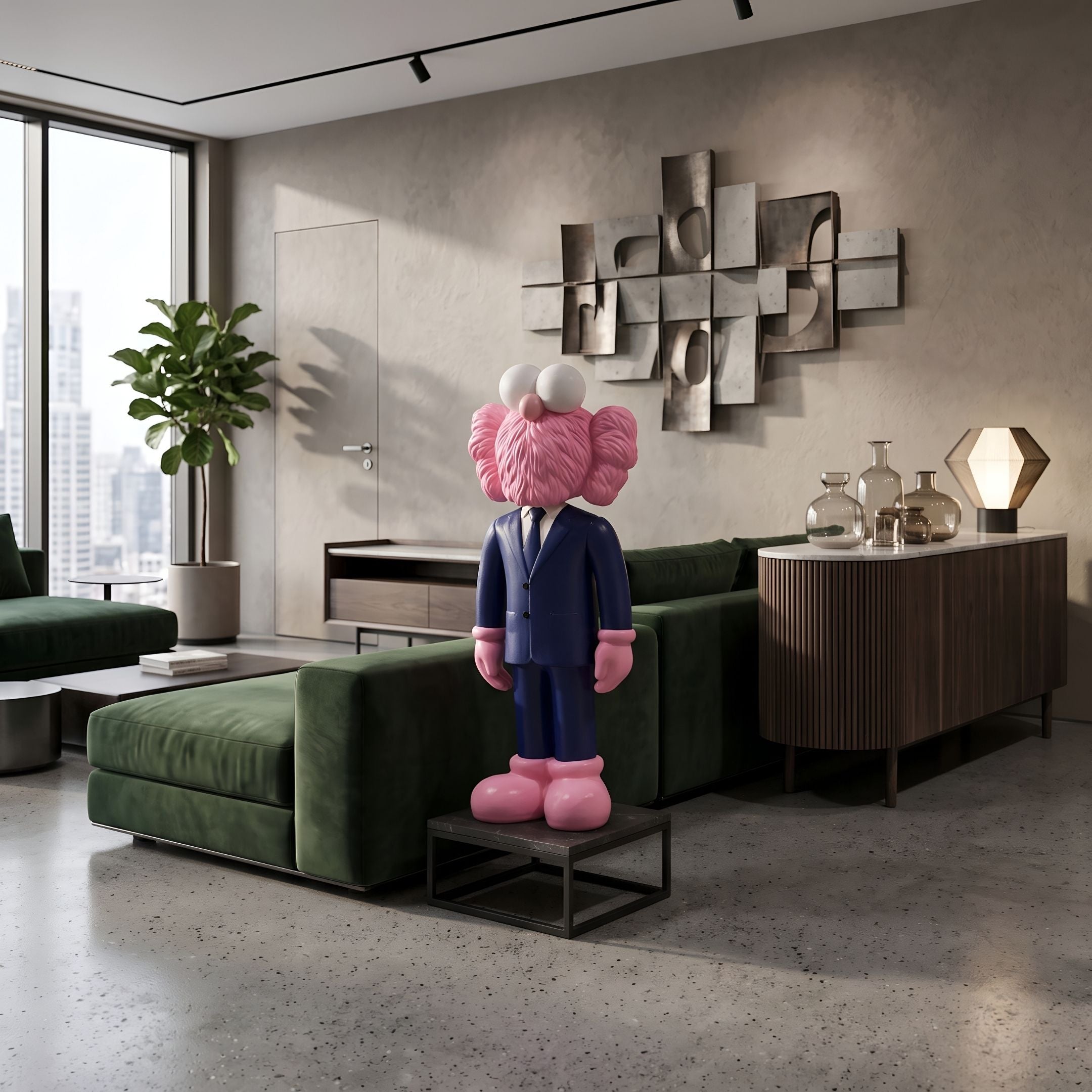 Deep Navy Blue Suit Iconify CEO Sculpture, 90cm pink figure with fluffy ears, standing on a small table in a living room with a green sofa and wall art.