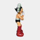 A side view of the Fiery Red Iconify Cosmic Boy Sculpture - 140cm by Giant Sculptures, a resin cartoon-style figure with black hair, white gloves, black shorts and silver belt, large red boots, and a pale face against a plain white background.