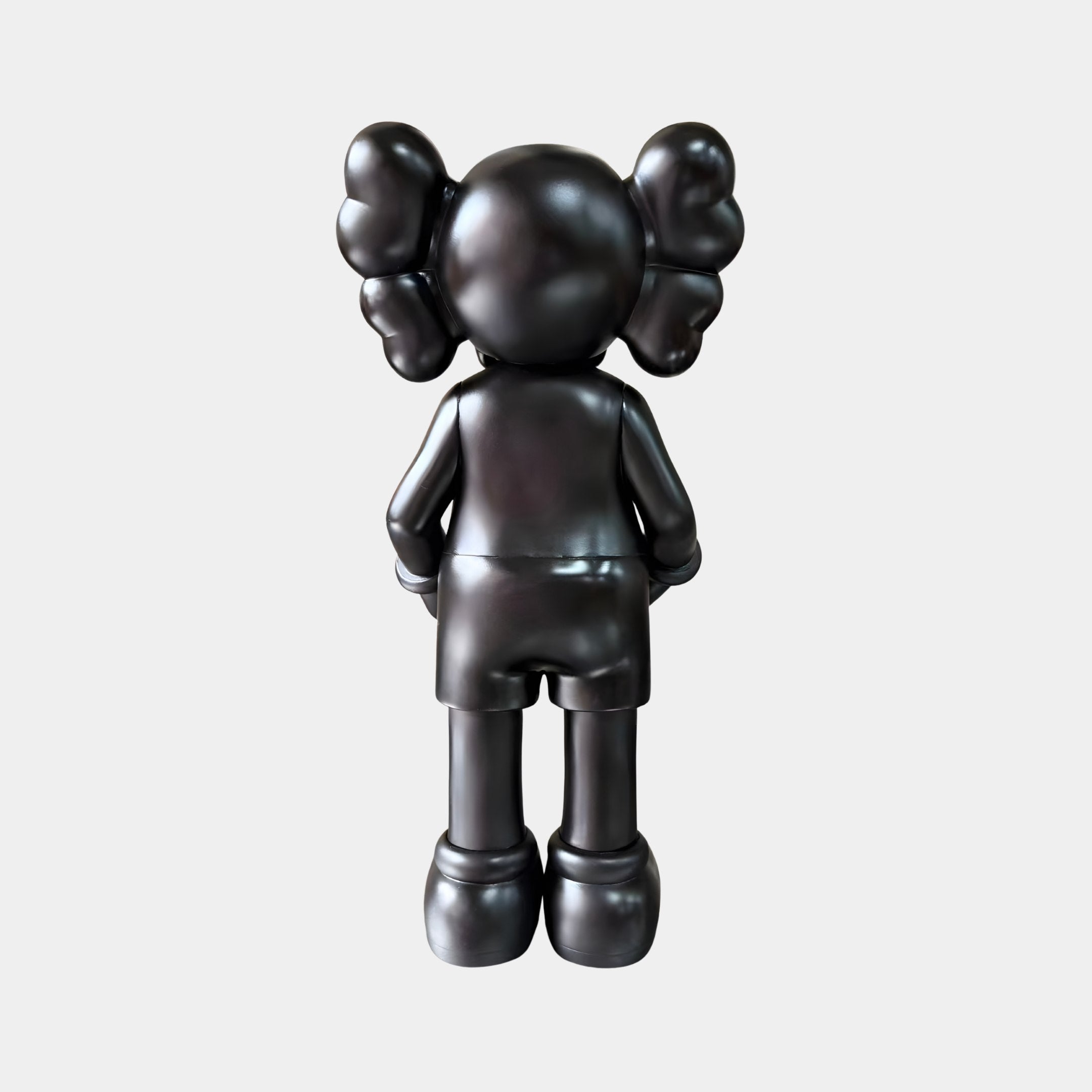 Rear view of the Midnight Black Iconify Dollars Figure 30cm by Giant Sculptures, a glossy black polyvinyl figure with twin ear shapes, on a light background.