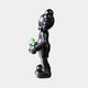 Side view of the Midnight Black Iconify Dollars Figure (30cm) by Giant Sculptures in matte black polyvinyl, holding a green dollar stack, on a plain background.