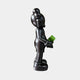 Side view of the Giant Sculptures Midnight Black Iconify Dollars Figure (30cm) in polyvinyl, holding a green dollar stack, shown on a plain light background.