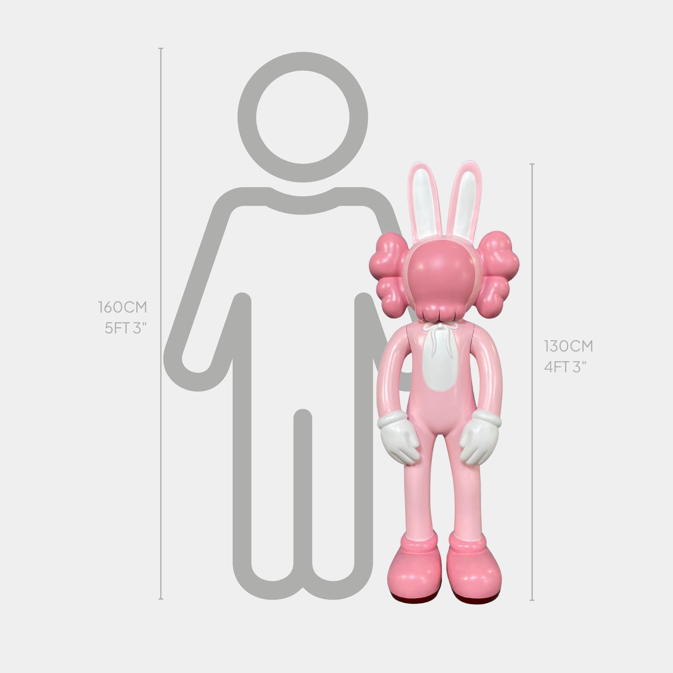 The Coral Pink Iconify Rabbit Sculpture by Giant Sculptures stands 130 cm (4 ft 3 in) tall, shown here with a gray human silhouette (160 cm/5 ft 3 in) for scale. The modern design features puffy hands and ears.
