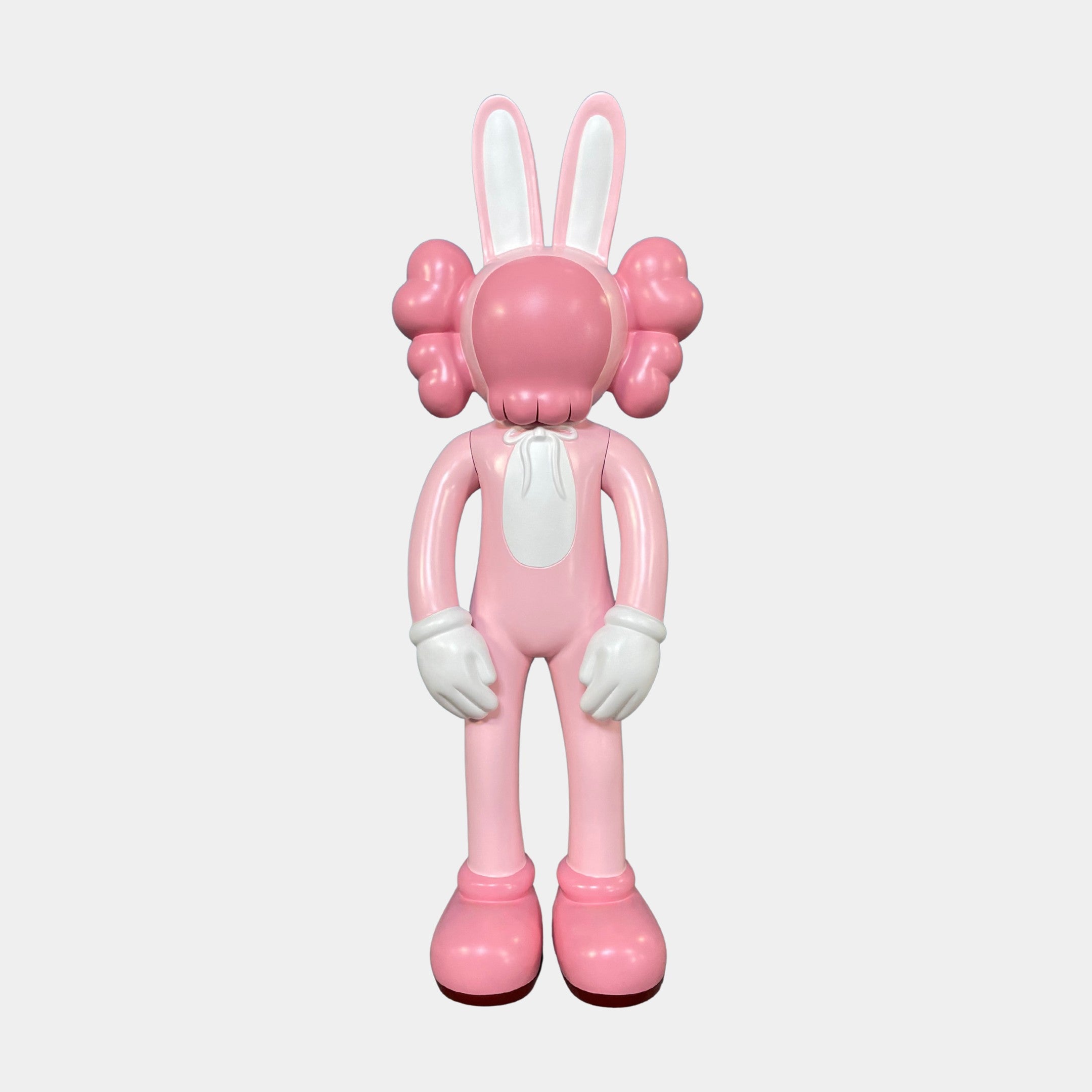The Giant Sculptures Petal Pink Iconify Rabbit Figure (30cm) features large gloved hands, puffy cheeks, and oversized shoes—this whimsical cartoon sculpture is a standout accent piece against any plain white background.