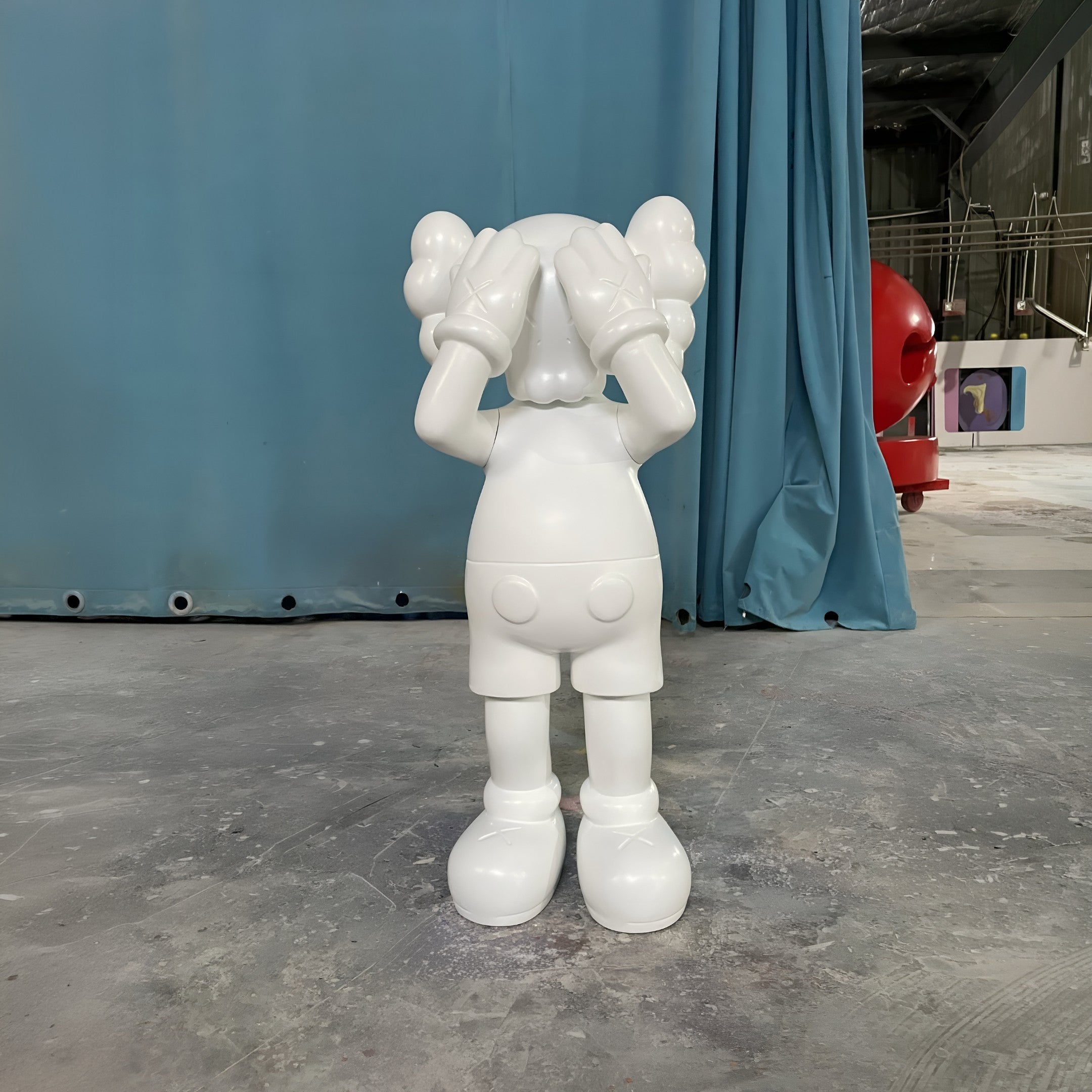 The Cloud White Iconify Silent Cry Sculpture - 91cm by Giant Sculptures features gloved hands covering its eyes, offering playful modern decor and a striking minimalist touch to any space.
