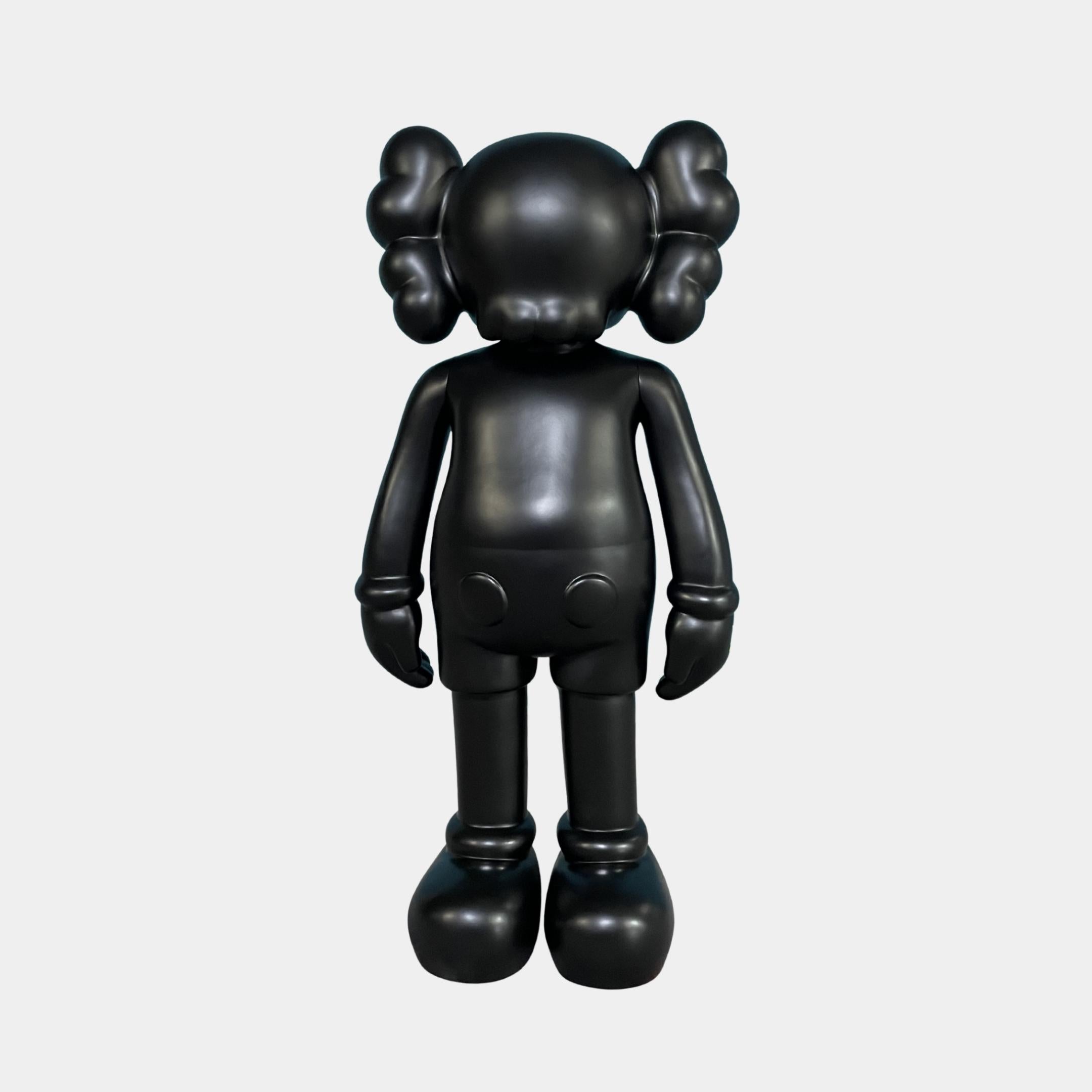 Midnight Black Iconify Standing Sculpture 70cm by Giant Sculptures, rear view of the matte black resin figure with rounded ears and oversized limbs on a plain background.