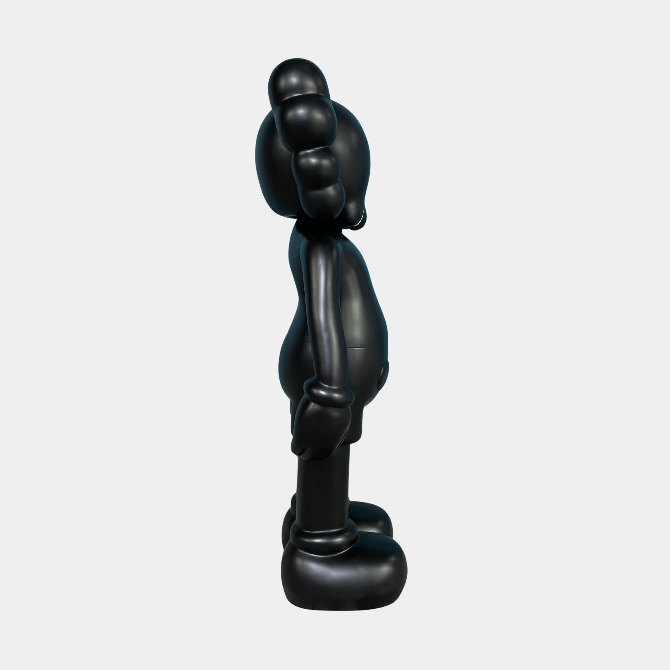 Side profile of the Midnight Black Iconify Standing Figure - 37cm by Giant Sculptures, showing the rounded torso, oversized feet, and puffy head shapes on a white background.