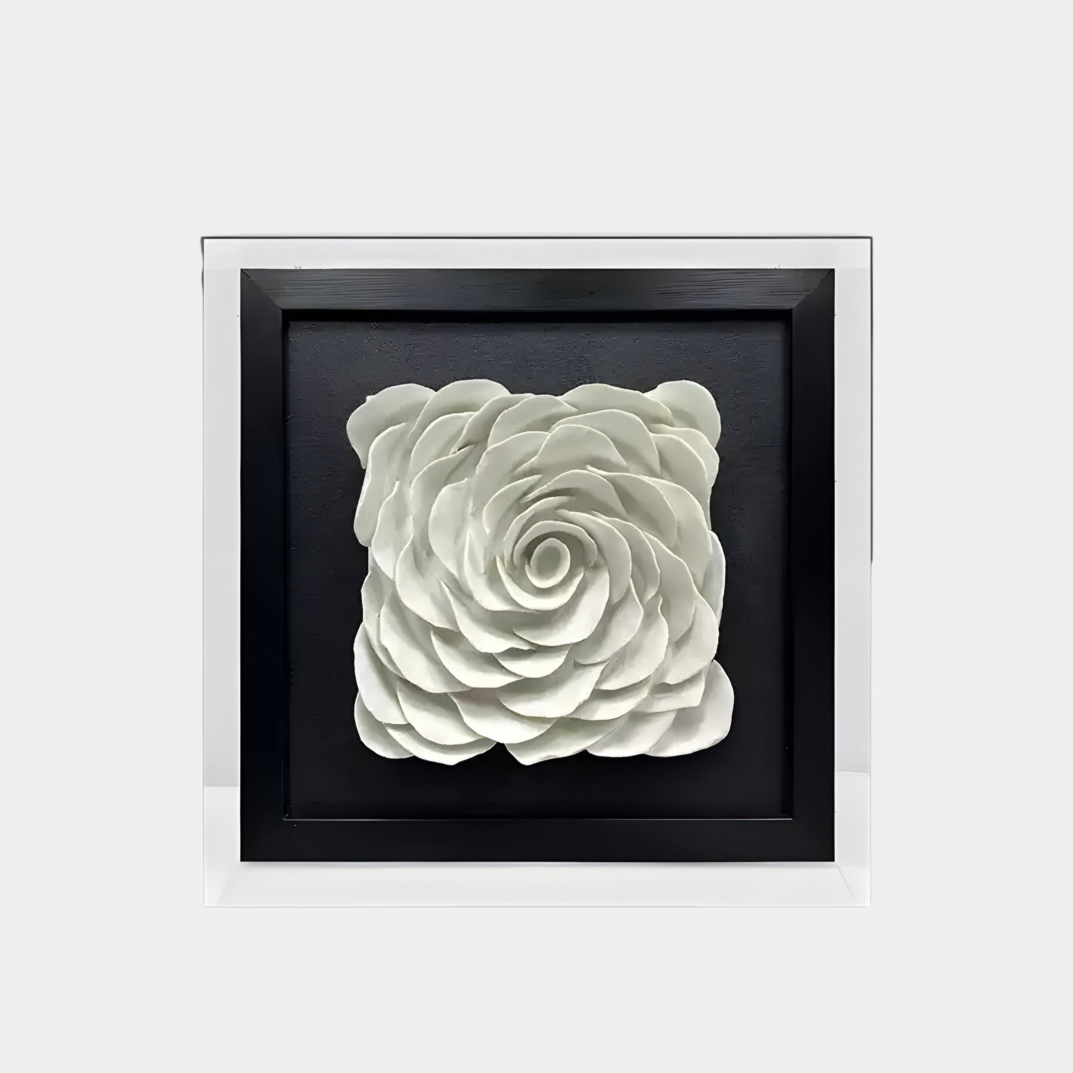 The Harmonia 3D Ceramic Rose Sculpture by Giant Sculptures features a white, layered rose design on a black square background. It is framed in sleek acrylic, offering a reflective and modern look.