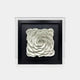 The Harmonia 3D Ceramic Rose Sculpture by Giant Sculptures features a white, layered rose design on a black square background. It is framed in sleek acrylic, offering a reflective and modern look.