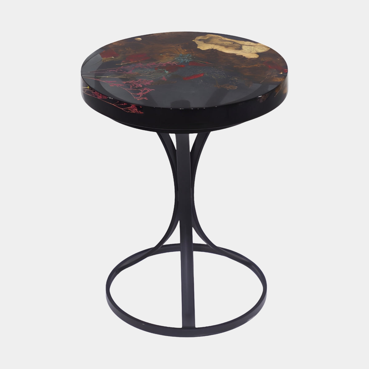 Multicoloured Inclusion Disc Side Table on Black Tripod, 57cm, with a resin top holding pink, red, turquoise and gold inclusions, set on a slim black steel tripod base, shown against a plain white background.