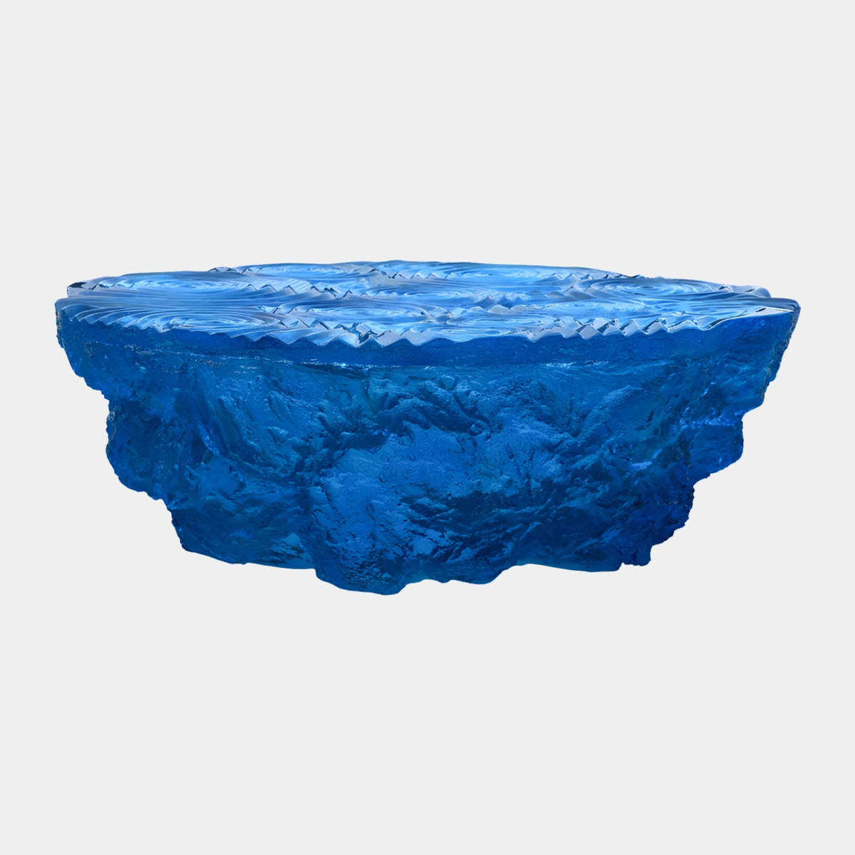 Blue Sawtooth Rim Resin Coffee Table, 110cm, with jagged tooth-edged rim over a rough quarried base, rippled top, on a plain white background.