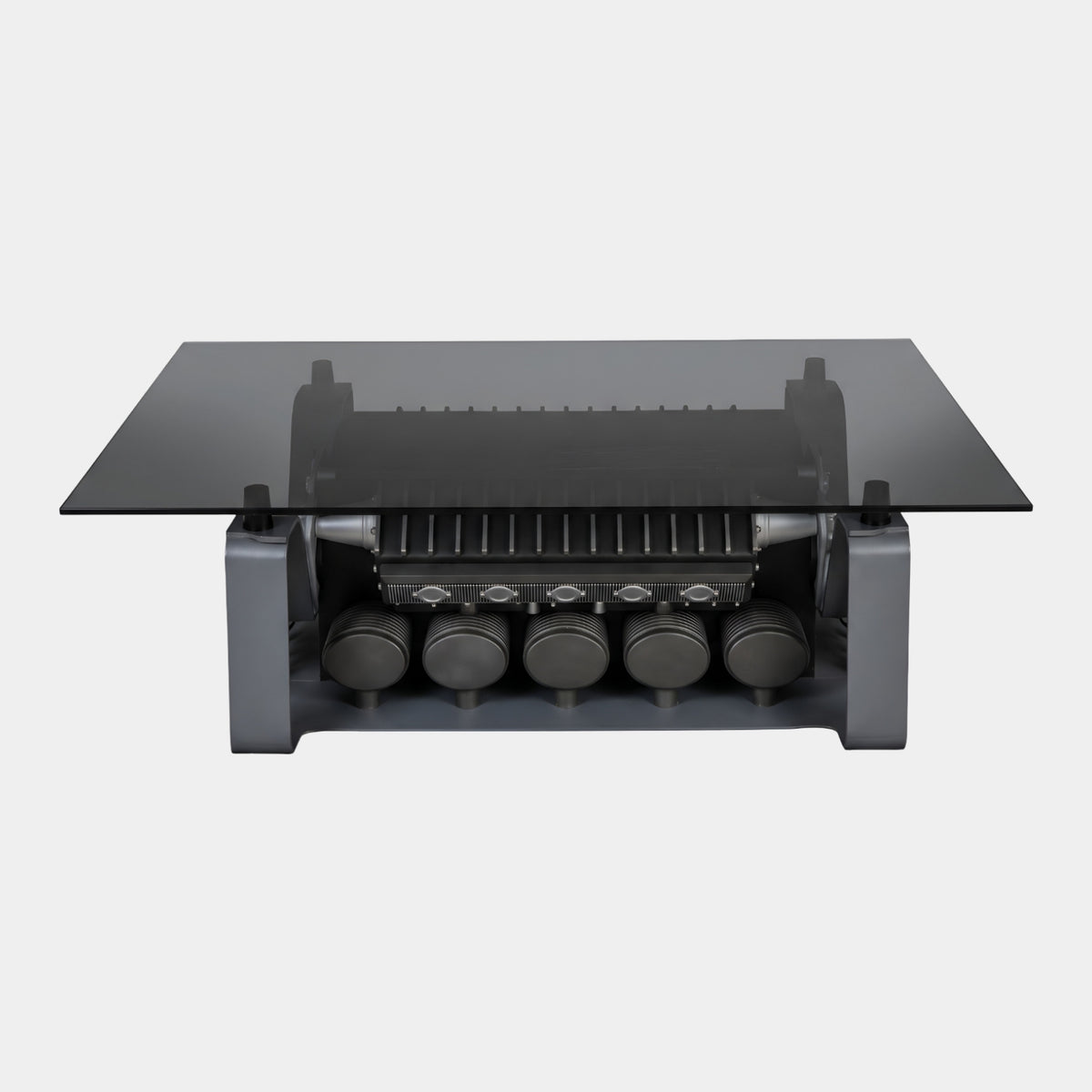 Black Glass Top Engine Block Coffee Table, 150cm, with five-cylinder engine form in grey metal and smoked glass top, shown on a plain white background.