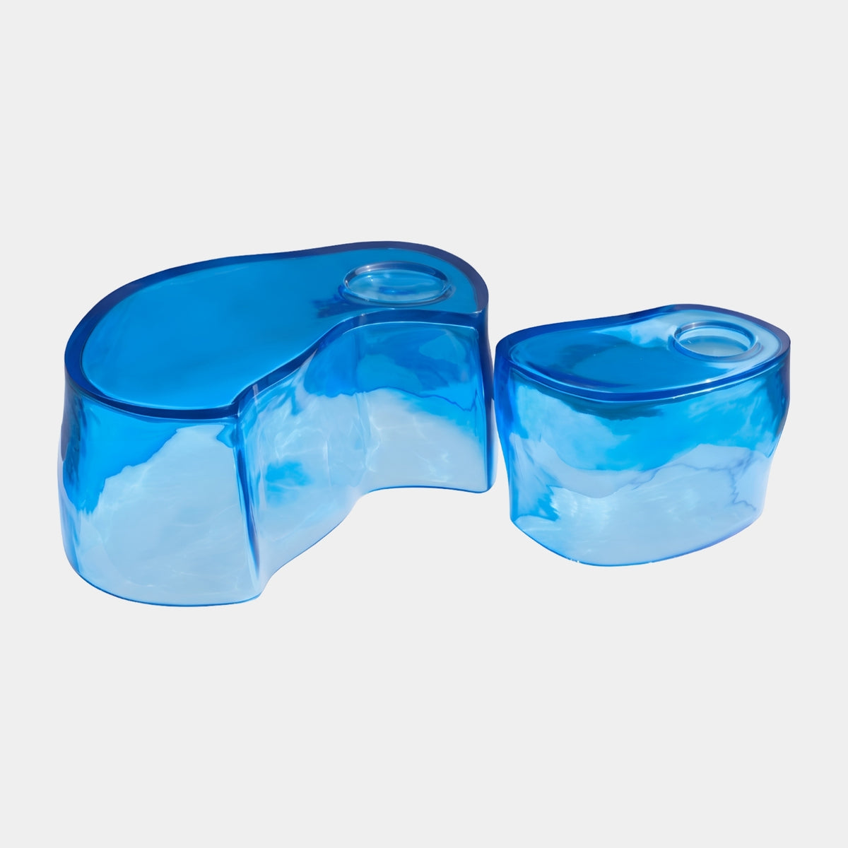 Blue Teardrop Lobe Resin Coffee Table in two sizes, 65/105cm, translucent blue organic forms with sunken dish tops, on a plain white background.