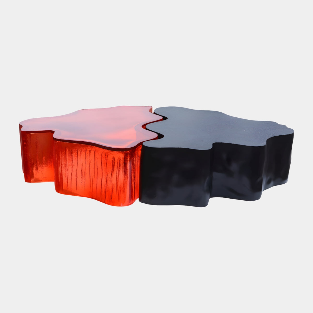 Red & Black Two Part Cast Resin Low Table - 160cm, an organic puzzle-shaped coffee table with translucent striated red resin and smooth opaque black sections, shown on a plain light background.