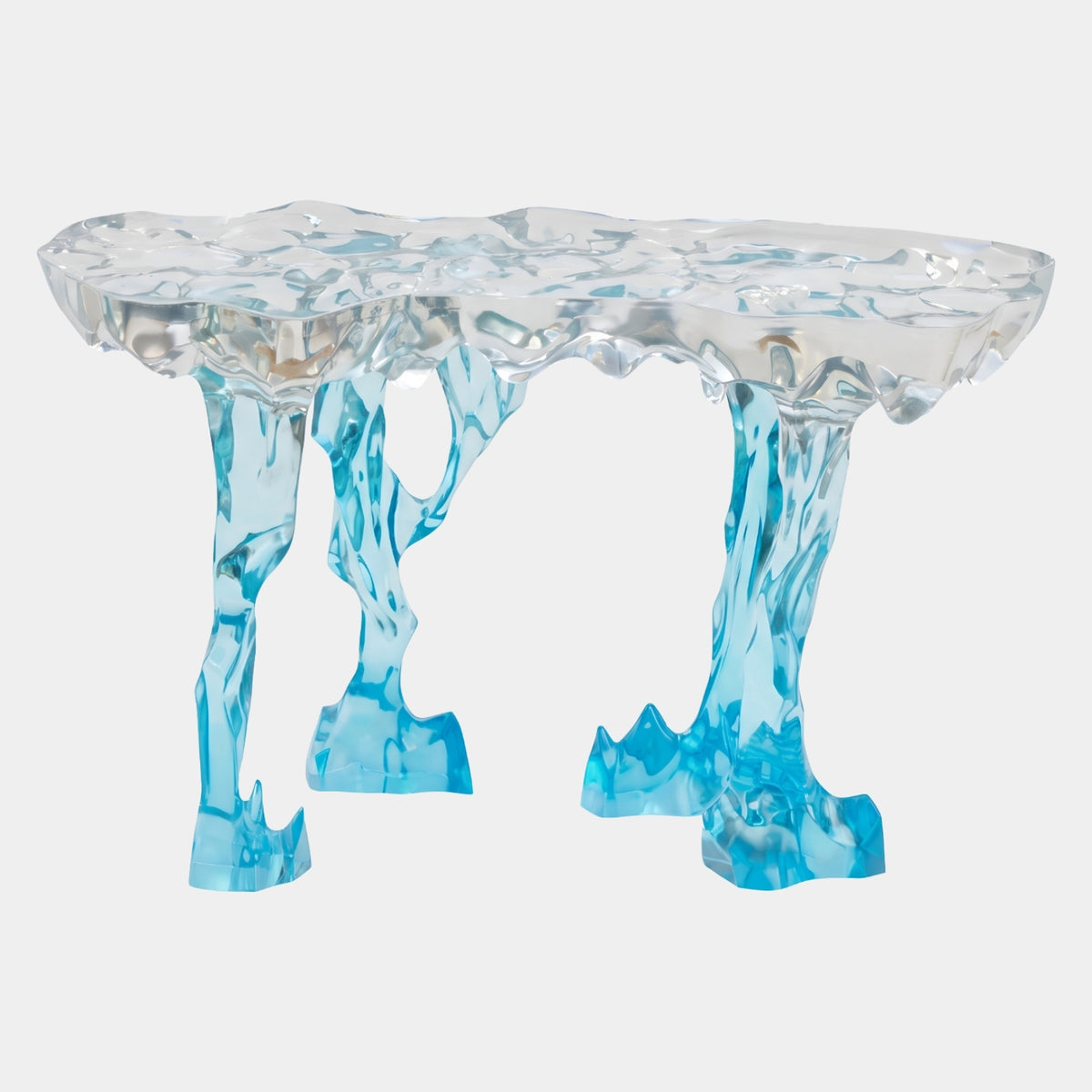 Clear to Aqua Icicle Leg Cast Resin Console, 140cm, with a bubbled frozen-look clear top on four jagged icicle legs shading to aqua at the feet, shown on a plain white background.