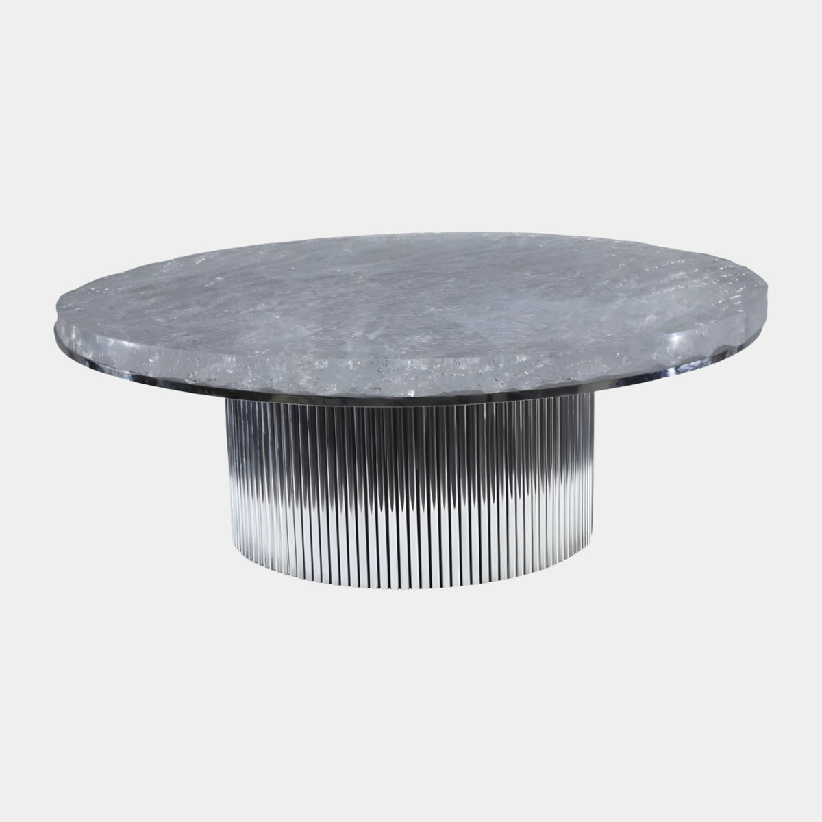 Frozen Disc Fluted Metal Drum Low Table - 80cm, a clear resin disc with a rough broken edge on a fluted silver metal drum base, shown on a plain white background.