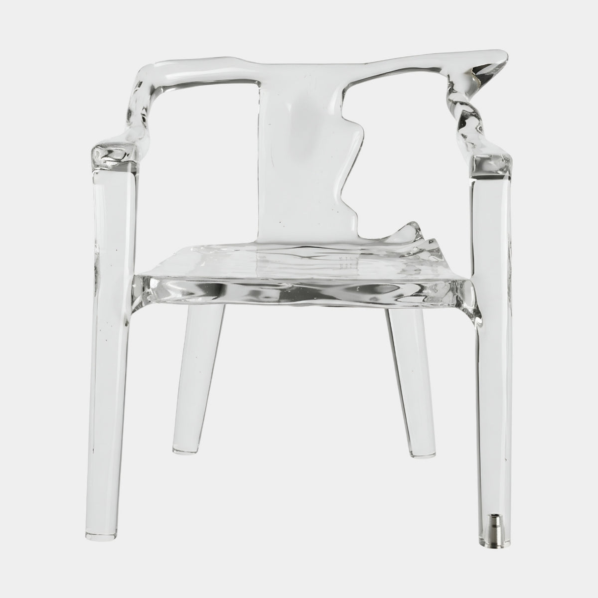 Clear Eroded Yoke Back Cast Resin Armchair, 85cm, with rippled seat and tapered legs, shown front-facing on a plain white background.