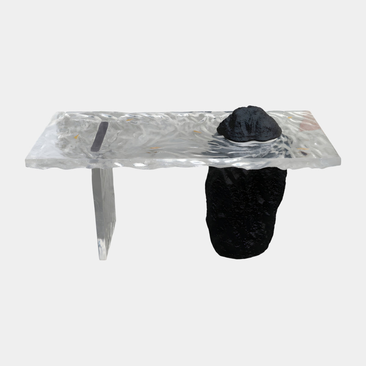 Clear Slab Black Rock & Tapered Leg Console, 140cm, with a resin tapered leg and rough black rock pedestal topped by a black peak, on a plain white background.