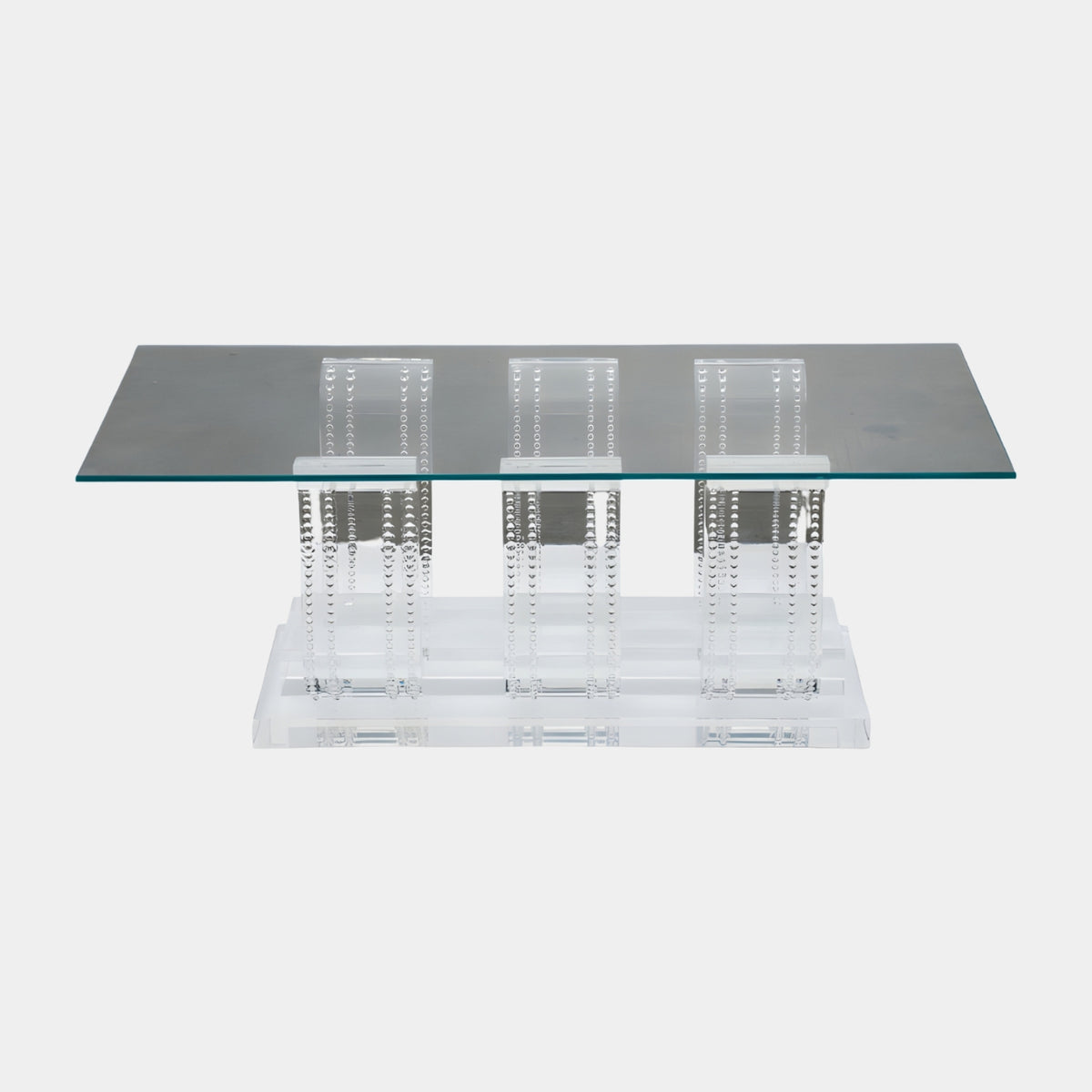 Clear Beaded Colonnade Glass Top Low Table (100cm) by Giant Sculptures, rectangular glass top on three beaded resin column pairs and stepped plinth, plain white background.