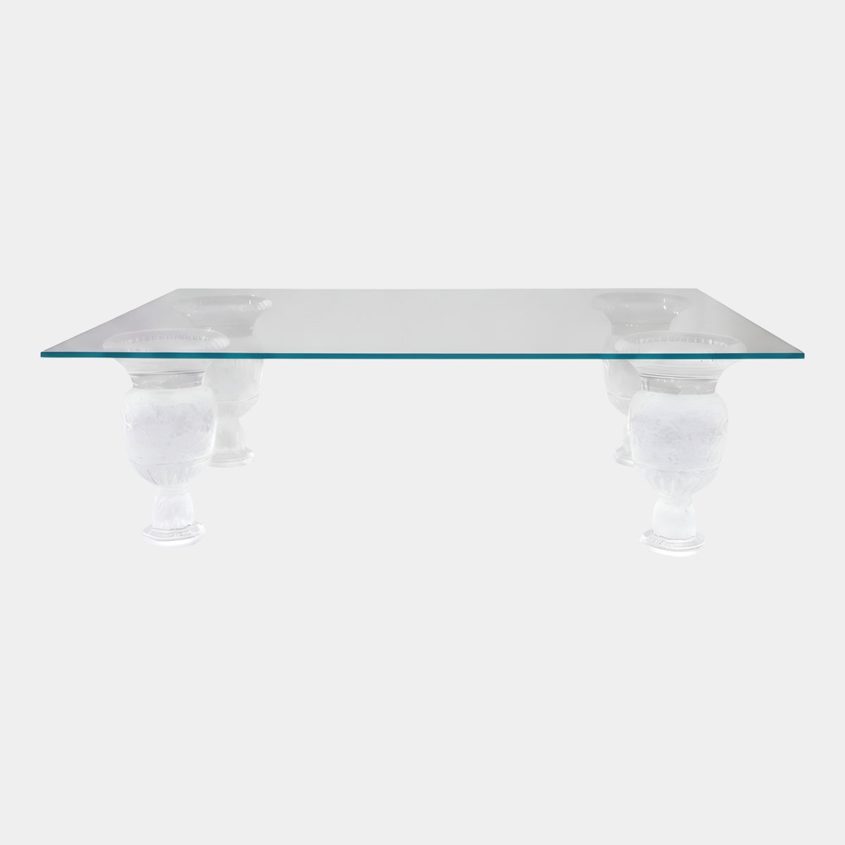 Clear Carved Urn Base Glass Low Table, 120cm, with a plain rectangular glass top on four carved acrylic urn legs, shown on a light grey background.