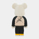 The Jacket Clad Plush Bear Sculpture by Giant Sculptures (70cm) is shown from the back with cream fur, wearing a tan and black streetwear art jacket featuring a crane, black pants, and yellow-white shoes.