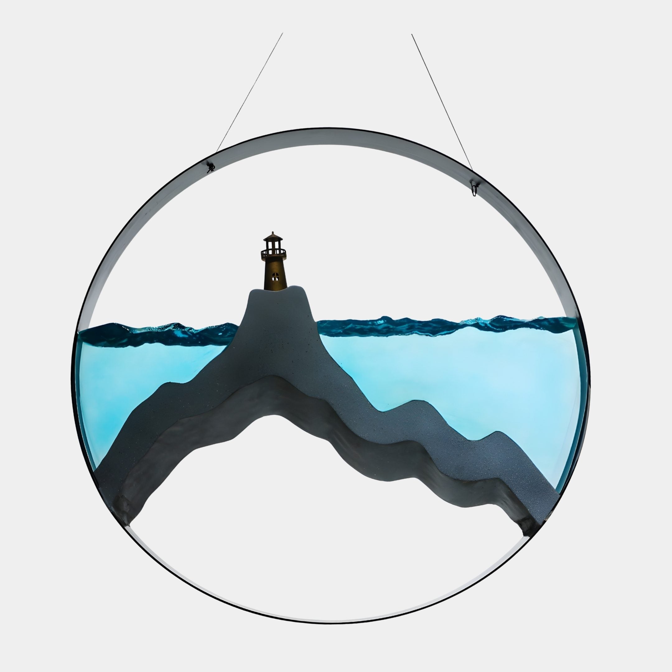 Black Circular Lighthouse Silhouette Resin & Metal Wall Art 71cm by Giant Sculptures, teal sea and grey mountain with brass lighthouse, hung on plain background.