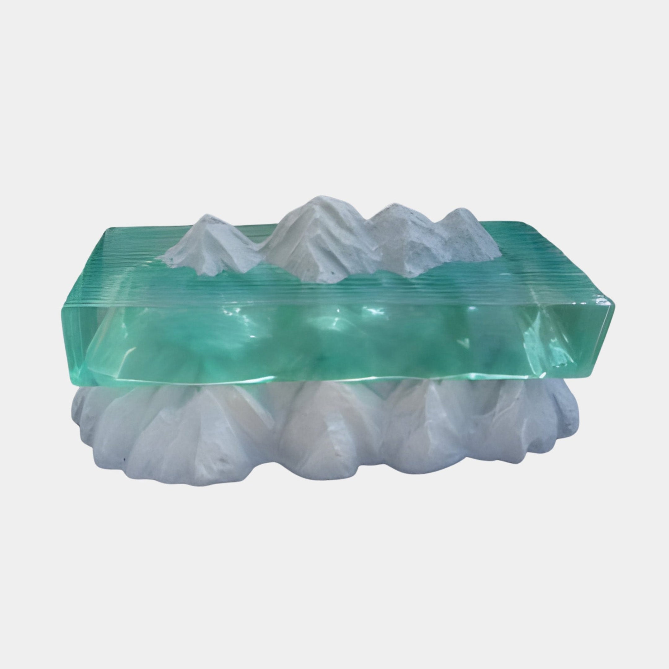 Giant Sculptures Emerald Resin Ocean Waves Landscape Console with white sculpted mountain ranges above and below a glowing green resin sea, on plain background.