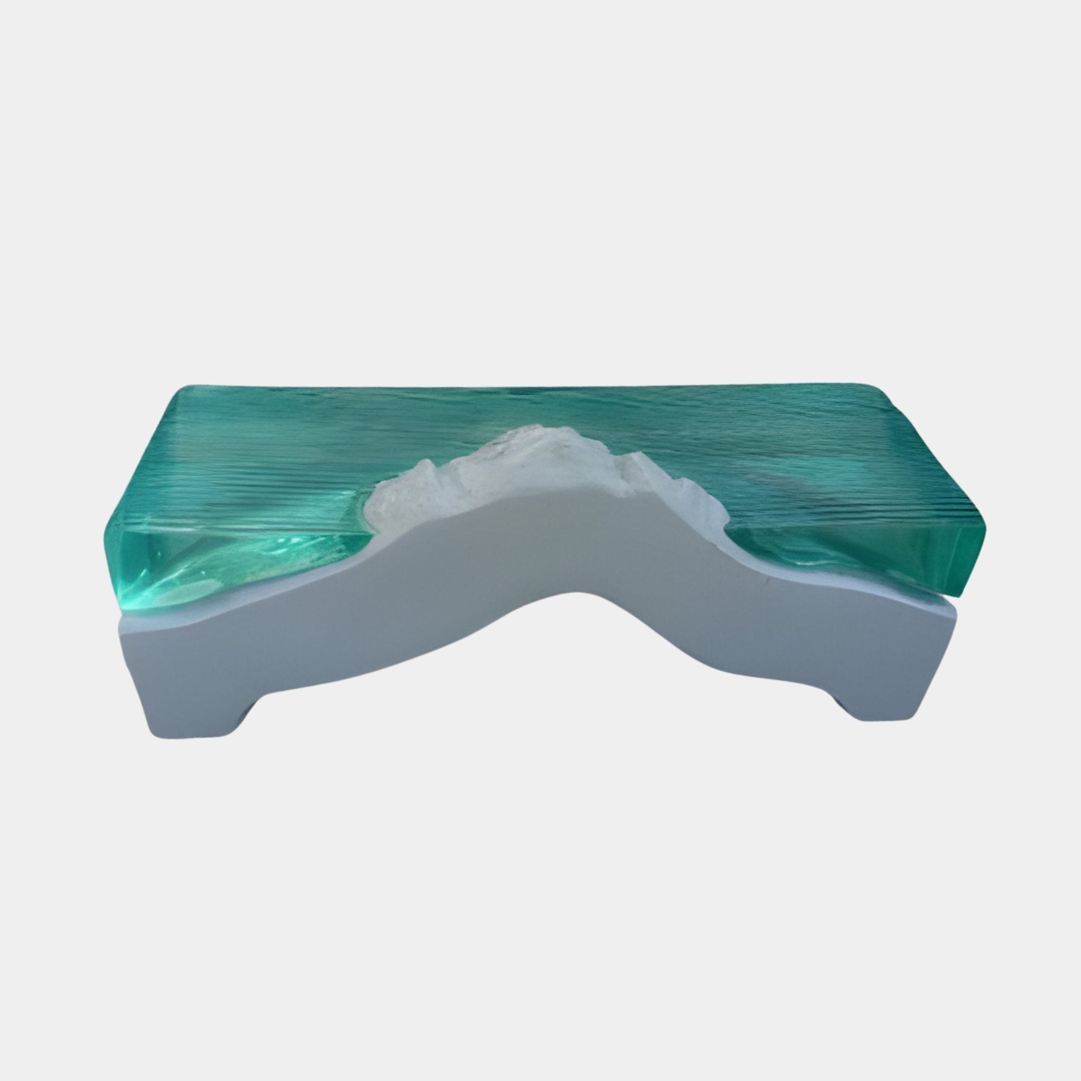 Clear Resin Surface & Landscape Console by Giant Sculptures, featuring a turquoise resin sea flowing over a white sculpted mountain base, shown against a plain background.