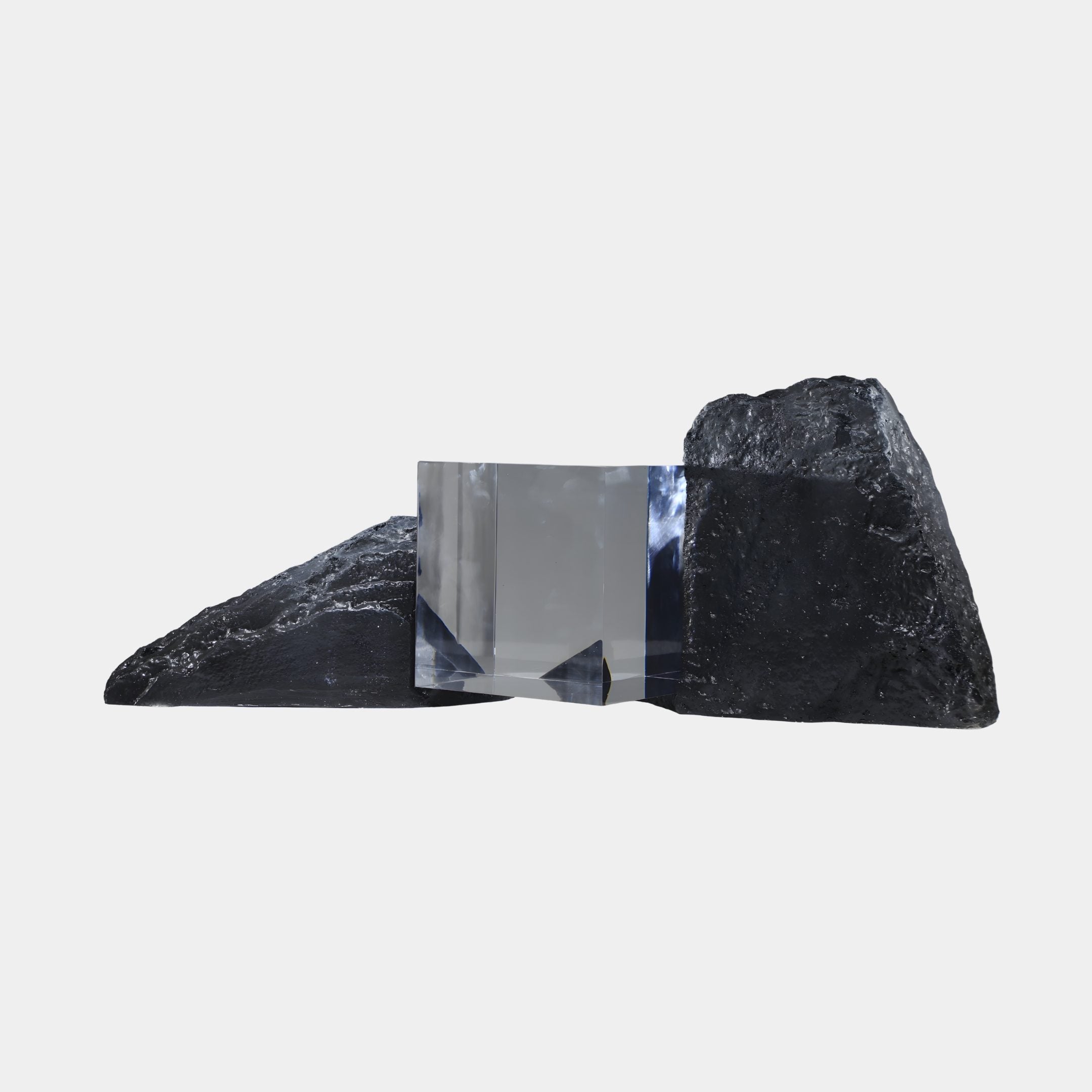 Clear Geometric Cube & Dual Black Rock Resin Sculpture by Giant Sculptures, 90cm, with a transparent cube wedged between two textured black rocks on a white background.