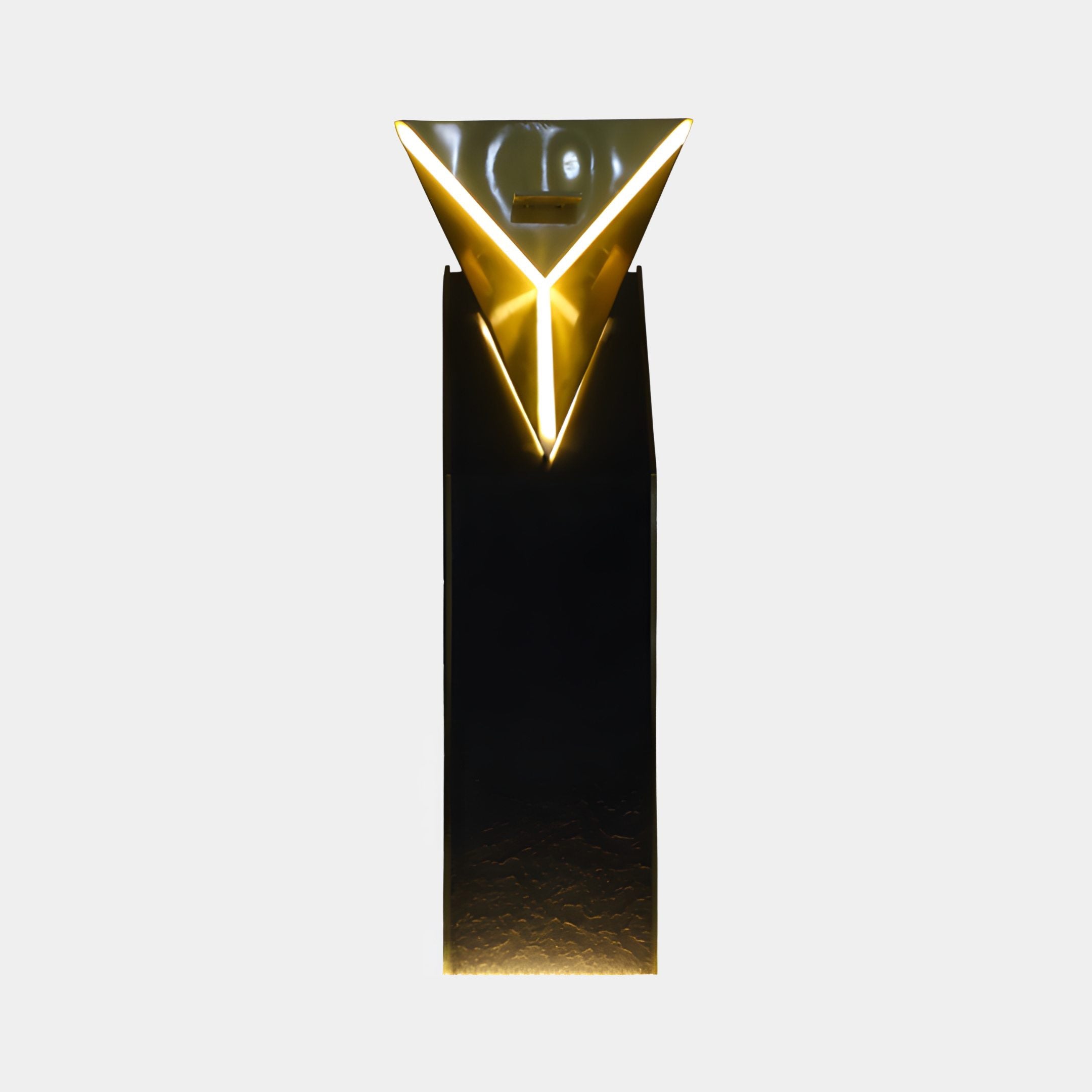 Gold Mirror Inverted Pyramid on Black Column Sculpture by Giant Sculptures, illuminated front view showing glowing V-shaped edges against a plain light background.