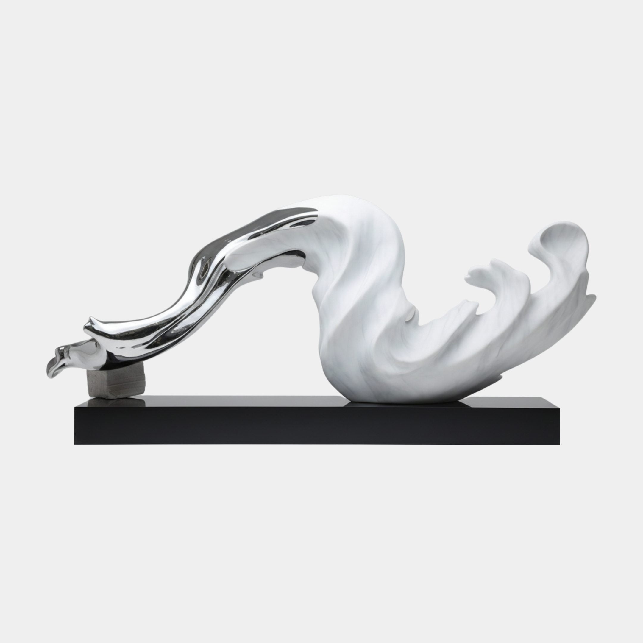 Chrome and white marble wave abstract fibreglass sculpture by Giant Sculptures, shown side-on with flowing curves on a black rectangular base against a plain background.