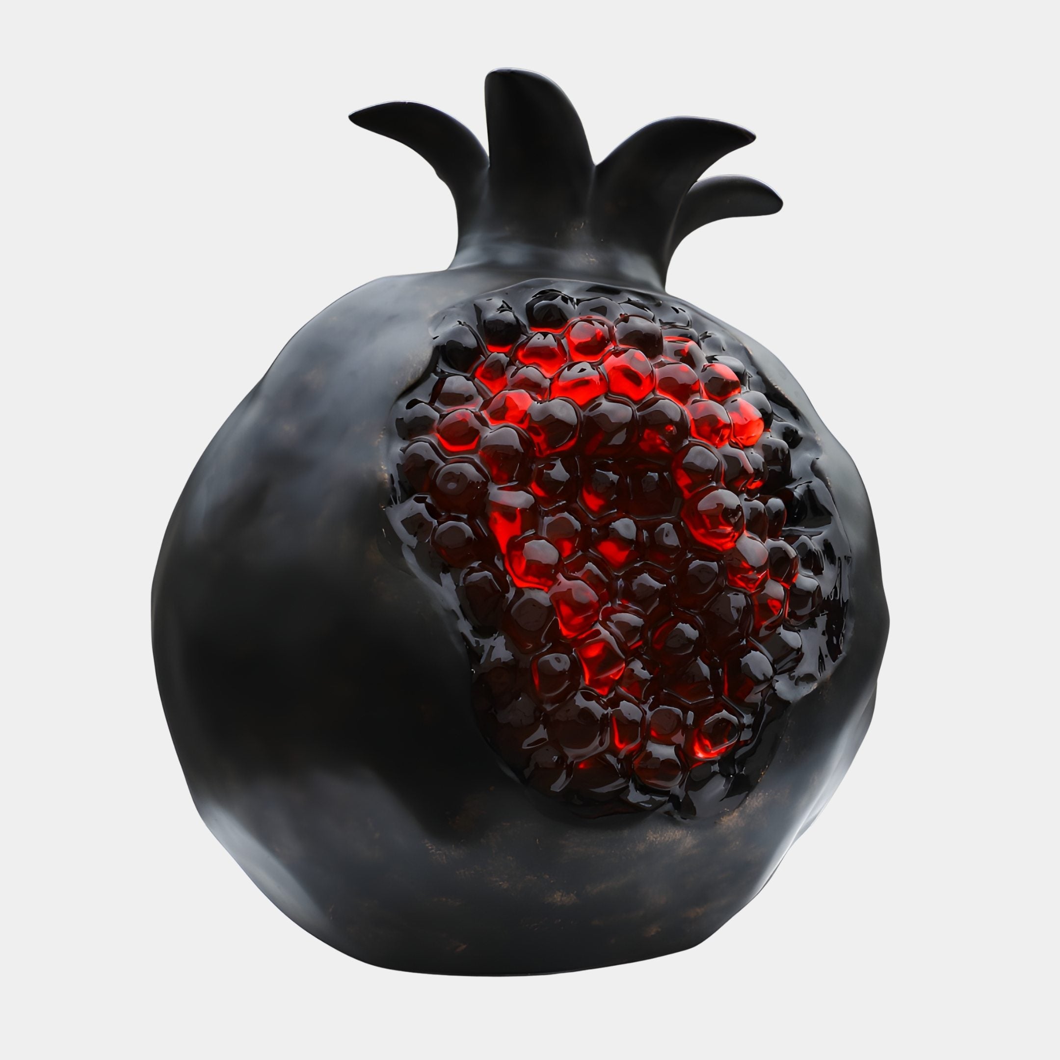 Giant Sculptures' 100cm Deep Bronze & Red Seeded Pomegranate Sculpture with glossy black shell opening to reveal glistening ruby resin seeds, on a plain background.