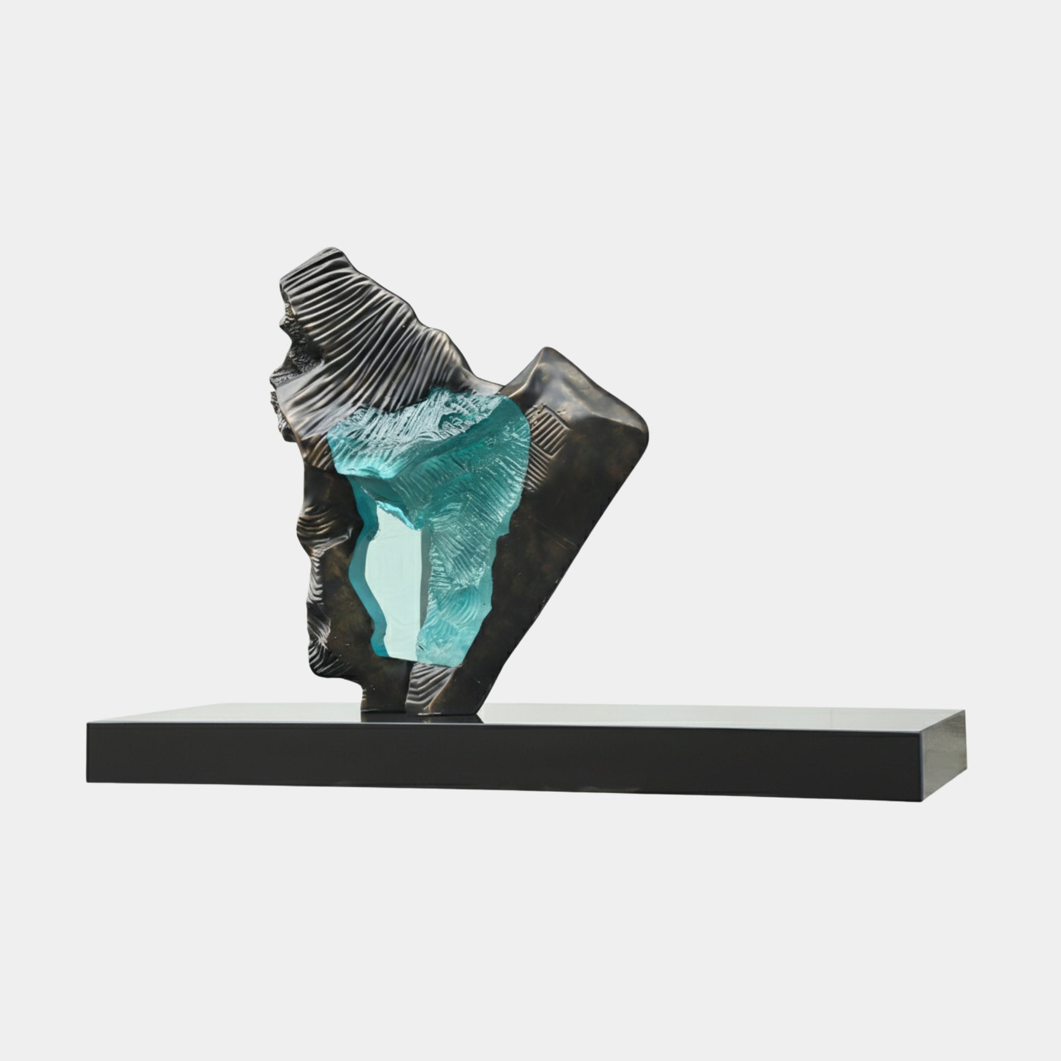 Textured Bronze Ridge & Teal Resin Wave Sculpture by Giant Sculptures, featuring a ribbed dark fibreglass form curling over a teal resin wave on a long black base.